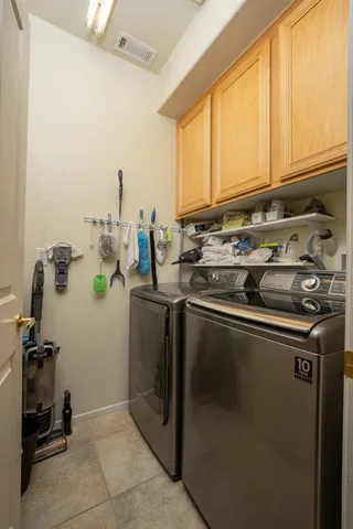 a kitchen with a sink appliances and cabinets