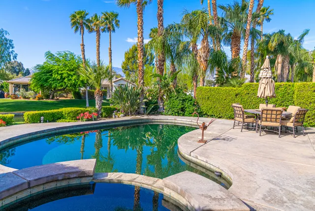 a view of a swimming pool with a patio