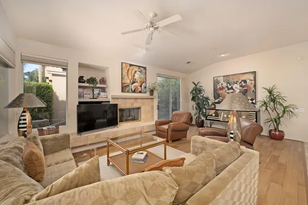 a living room with furniture and a fireplace