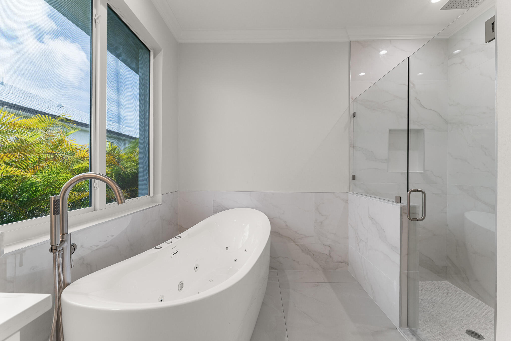 5470 Southeast Front Avenue Stuart, FL 34997 - Photo 24 of 37 a bathroom with a bathtub and a shower