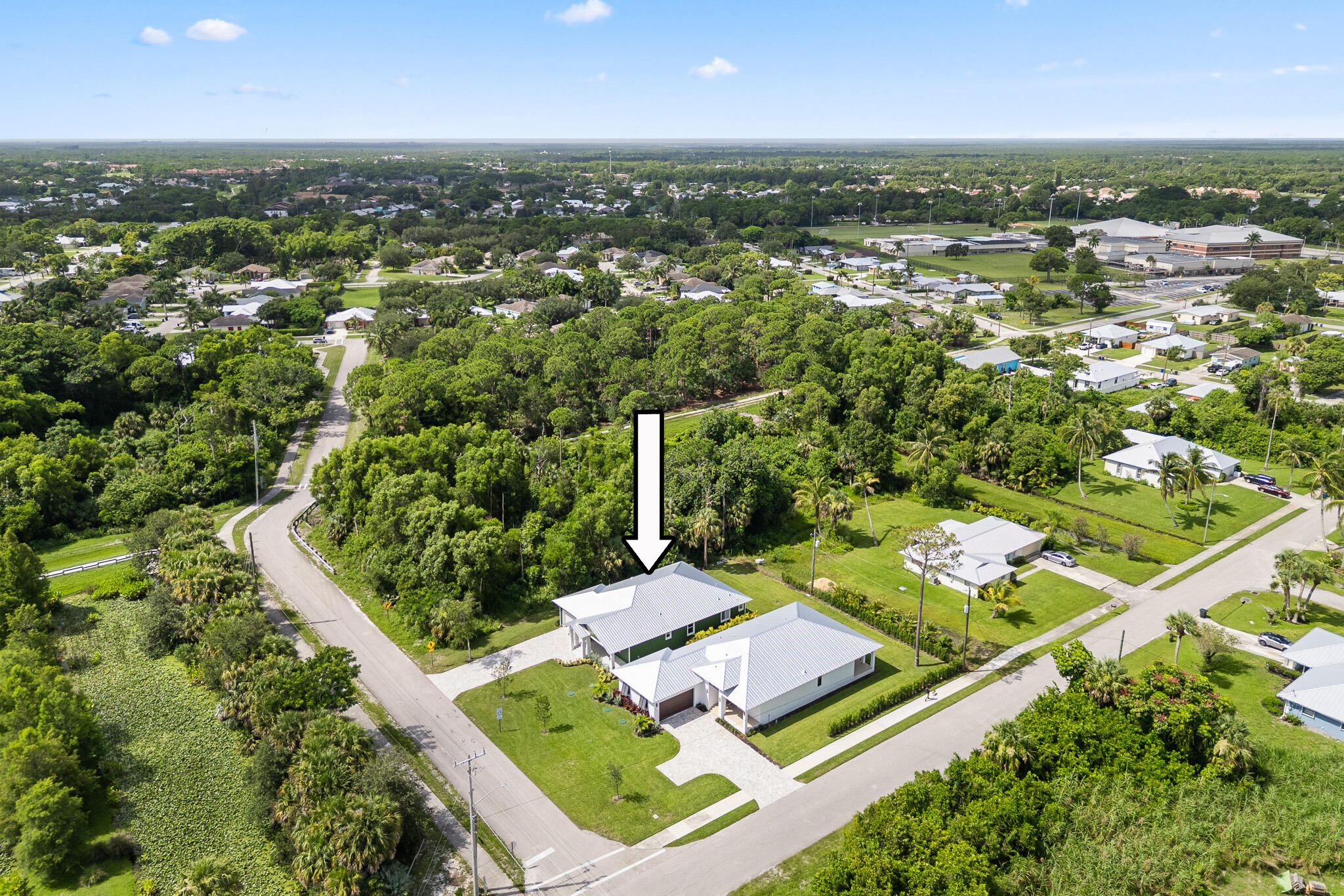 5470 Southeast Front Avenue Stuart, FL 34997 - Photo 3 of 37 an aerial view of residential houses with outdoor space