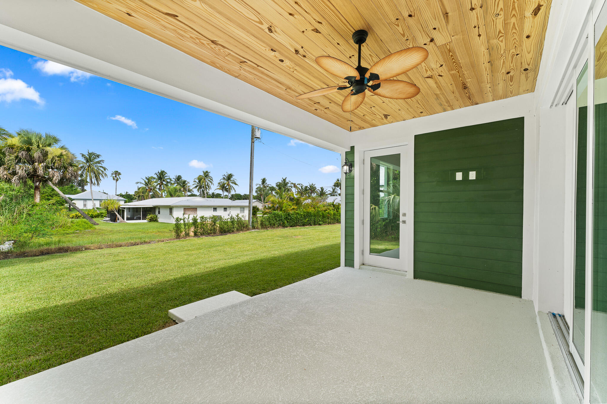 5470 Southeast Front Avenue Stuart, FL 34997 - Photo 32 of 37 a front view of a house with a yard