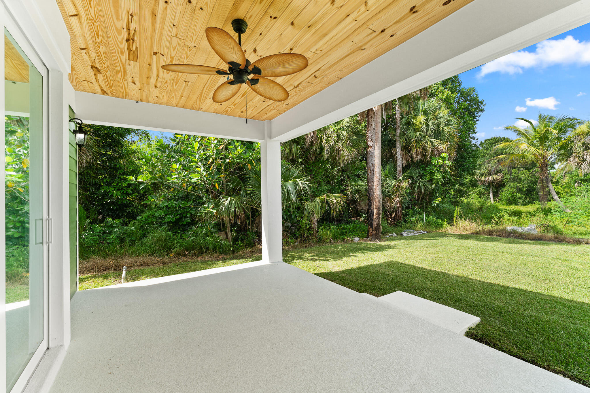 5470 Southeast Front Avenue Stuart, FL 34997 - Photo 33 of 37 a view of a porch with a garden