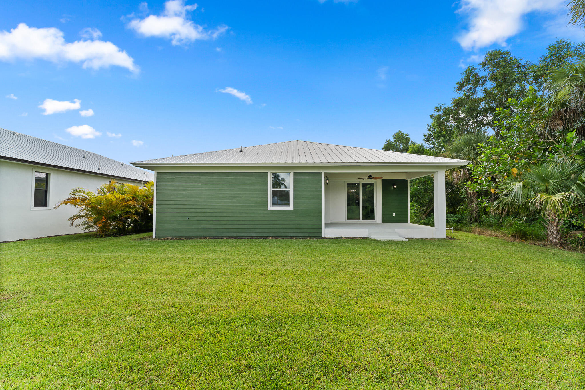 5470 Southeast Front Avenue Stuart, FL 34997 - Photo 35 of 37 a view of a house with a backyard