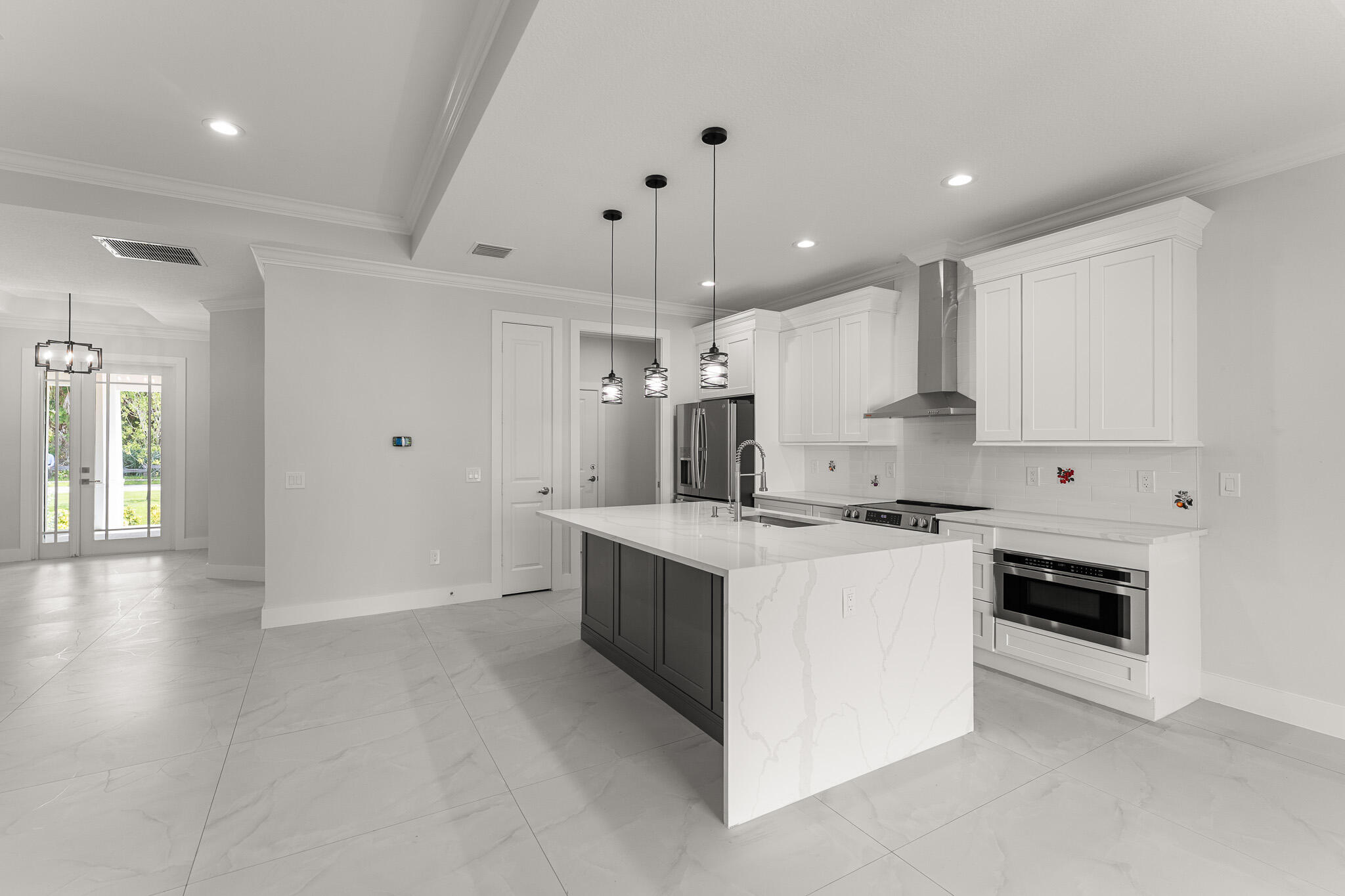 5470 Southeast Front Avenue Stuart, FL 34997 - Photo 9 of 37 a kitchen with cabinets and white stainless steel appliances