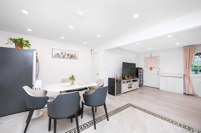 a kitchen with stainless steel appliances kitchen island granite countertop a sink and cabinets