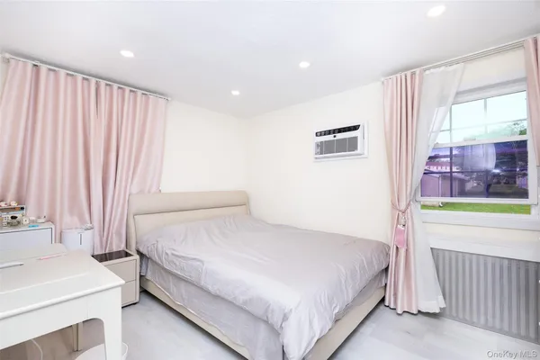 a bedroom with a bed and a table