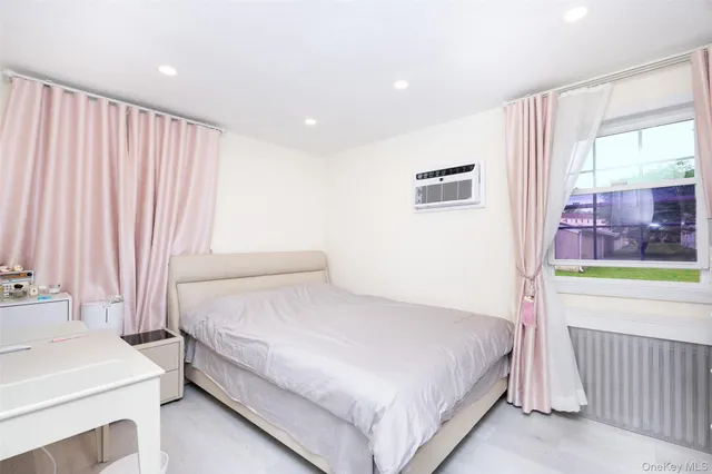 a bedroom with a bed and a table