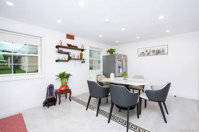 a dining room with furniture and window