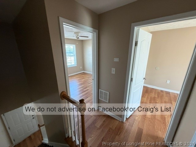6467 Yadkin Road, Unit 1 Fayetteville, NC 28303 - Photo 5 of 9 view of a hallway with wooden floor and front door