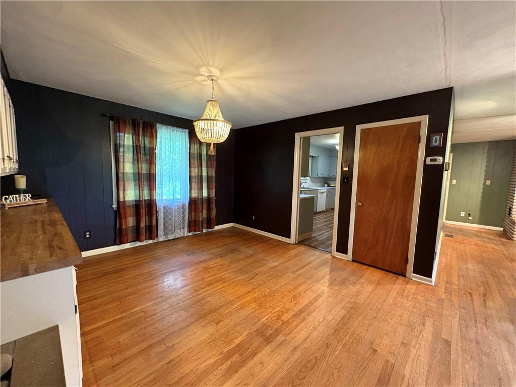 320 Cherry Hill Road Greenville, PA 16125 - Photo 14 of 38 a view of an empty room with wooden floor and a window