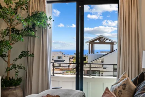 a view of a balcony with a potted plants