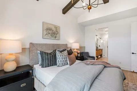 a bedroom with bed and window