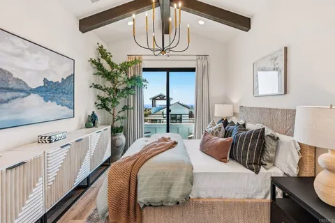 a bedroom with furniture and a window