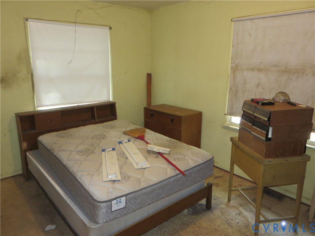4292 Range Road Mechanicsville, VA 23111 - Photo 17 of 50 a bed sitting in a bedroom next to a window