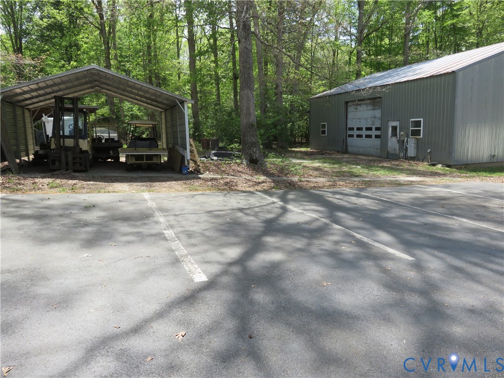 4292 Range Road Mechanicsville, VA 23111 - Photo 20 of 50 a view of a house with backyard and trees