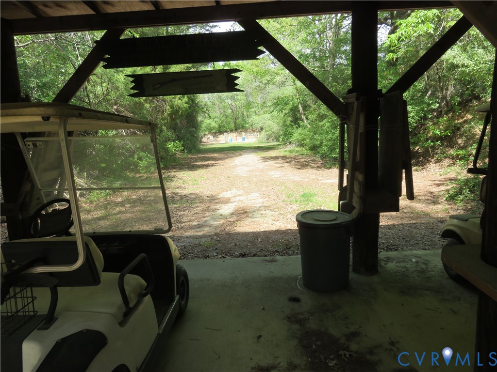 4292 Range Road Mechanicsville, VA 23111 - Photo 37 of 50 a view of a patio with table and chairs next to a yard