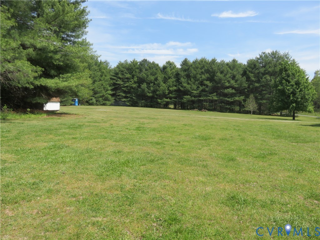 4292 Range Road Mechanicsville, VA 23111 - Photo 4 of 50 a view of a field with trees in the background