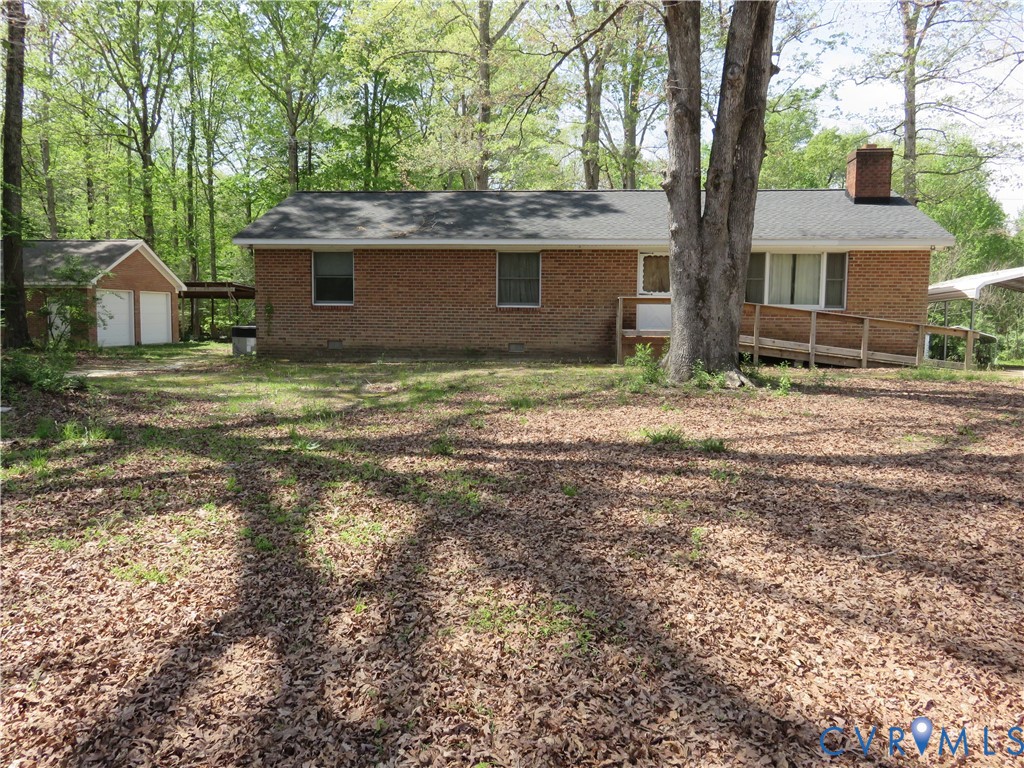 4292 Range Road Mechanicsville, VA 23111 - Photo 5 of 50 a backyard of a house with large trees and barbeque oven