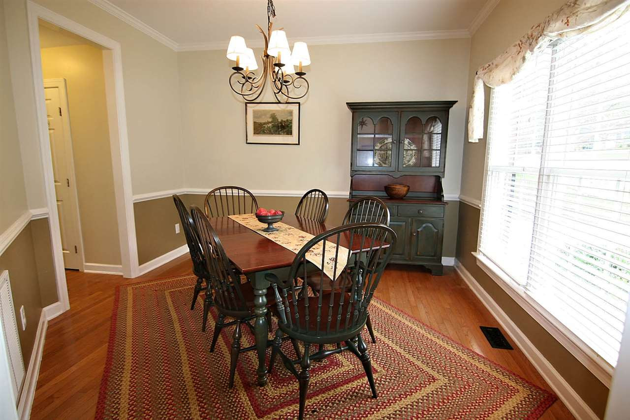 4109 Batiste Road Raleigh, NC 27613 - Photo 6 of 25 Dining Room with hardwoods, Chair Rail and Crown Molding Dining Room