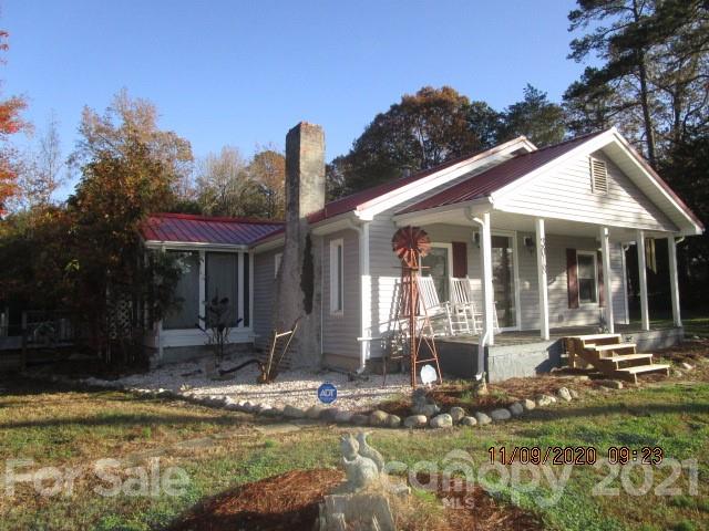 3018 Goldmine Road Monroe, NC 28110 - Photo 1 of 33 a front view of a house with swimming pool and porch with furniture