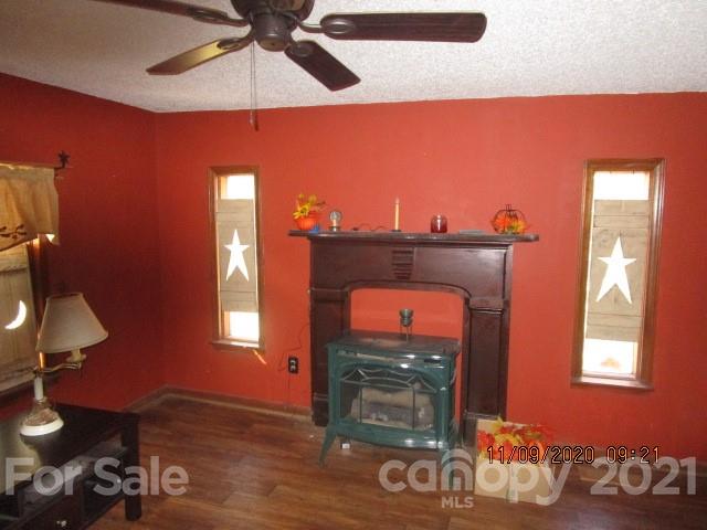 3018 Goldmine Road Monroe, NC 28110 - Photo 15 of 33 a living room with furniture and a fireplace