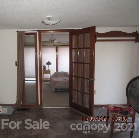 3018 Goldmine Road Monroe, NC 28110 - Photo 26 of 33 a view of walk in closet with clothes and shoes