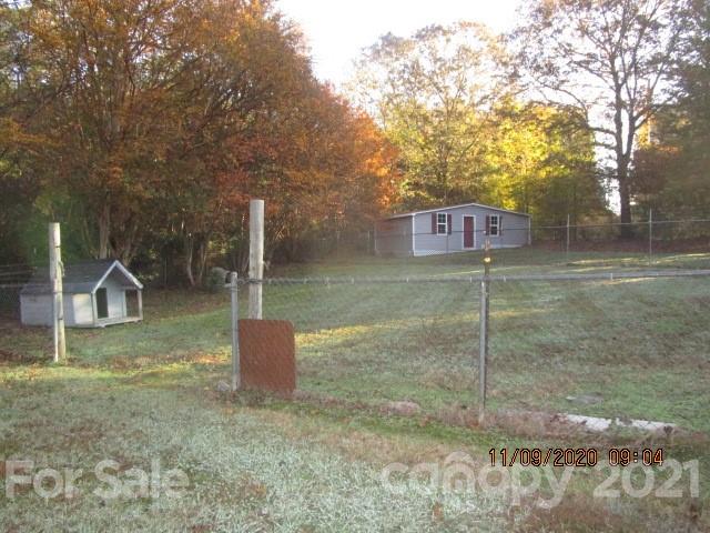 3018 Goldmine Road Monroe, NC 28110 - Photo 5 of 33 a backyard of a house with lots of green space