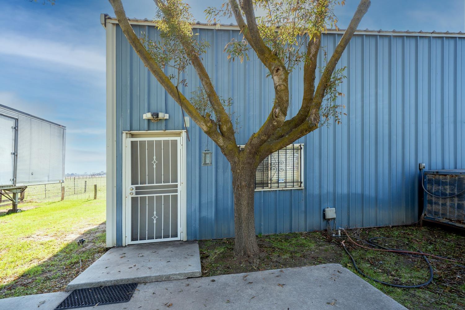 26166 Eddy Way Madera, CA 93638 - Photo 23 of 25 a view of a house with a swimming pool