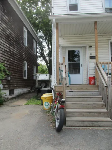 a view of house with outdoor seating space