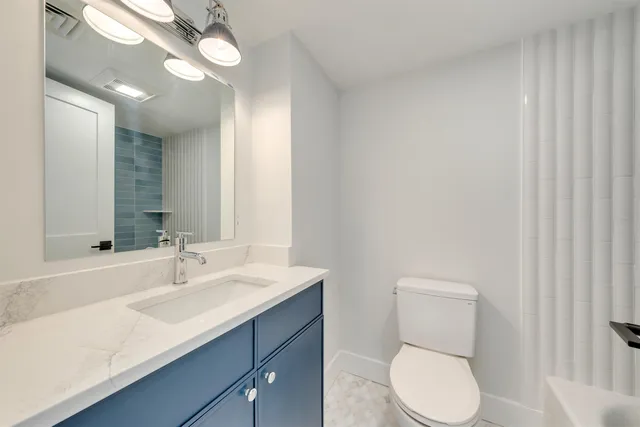 a view of a swimming pool with a lounge chair