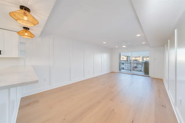 a bathroom with a sink vanity mirror and toilet