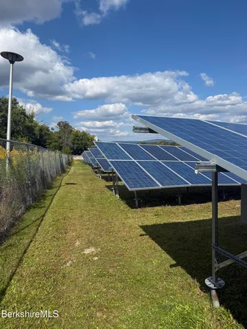 a view of a swimming pool with an outdoor seating