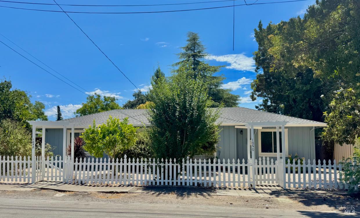 1050 Fulkerson Street Santa Rosa, CA 95404 - Photo 1 of 1 a front view of a house with a garden