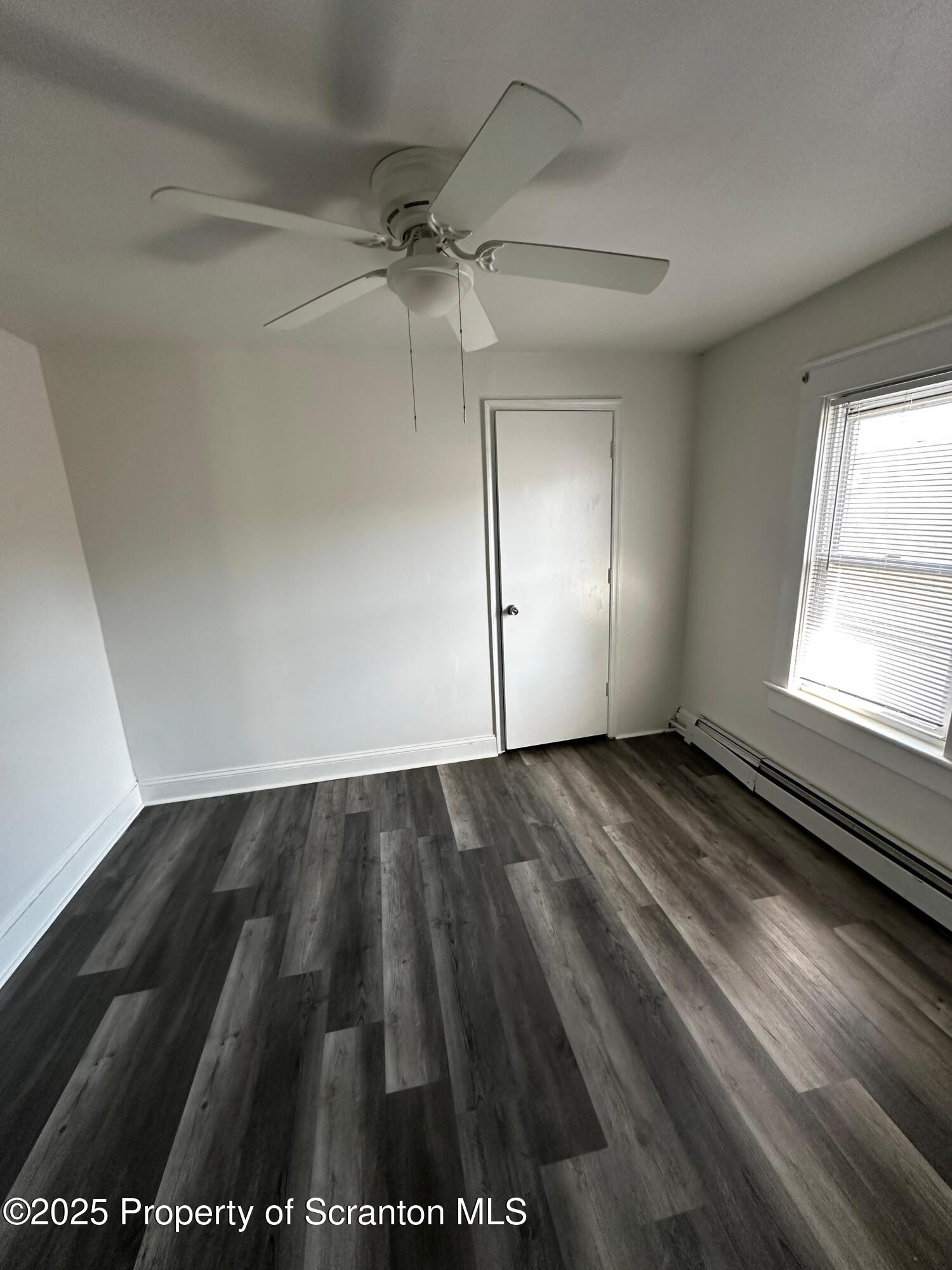 1417 Cornell Street, Unit 2 Scranton, PA 18504 - Photo 5 of 11 wooden floor in an empty room with a window