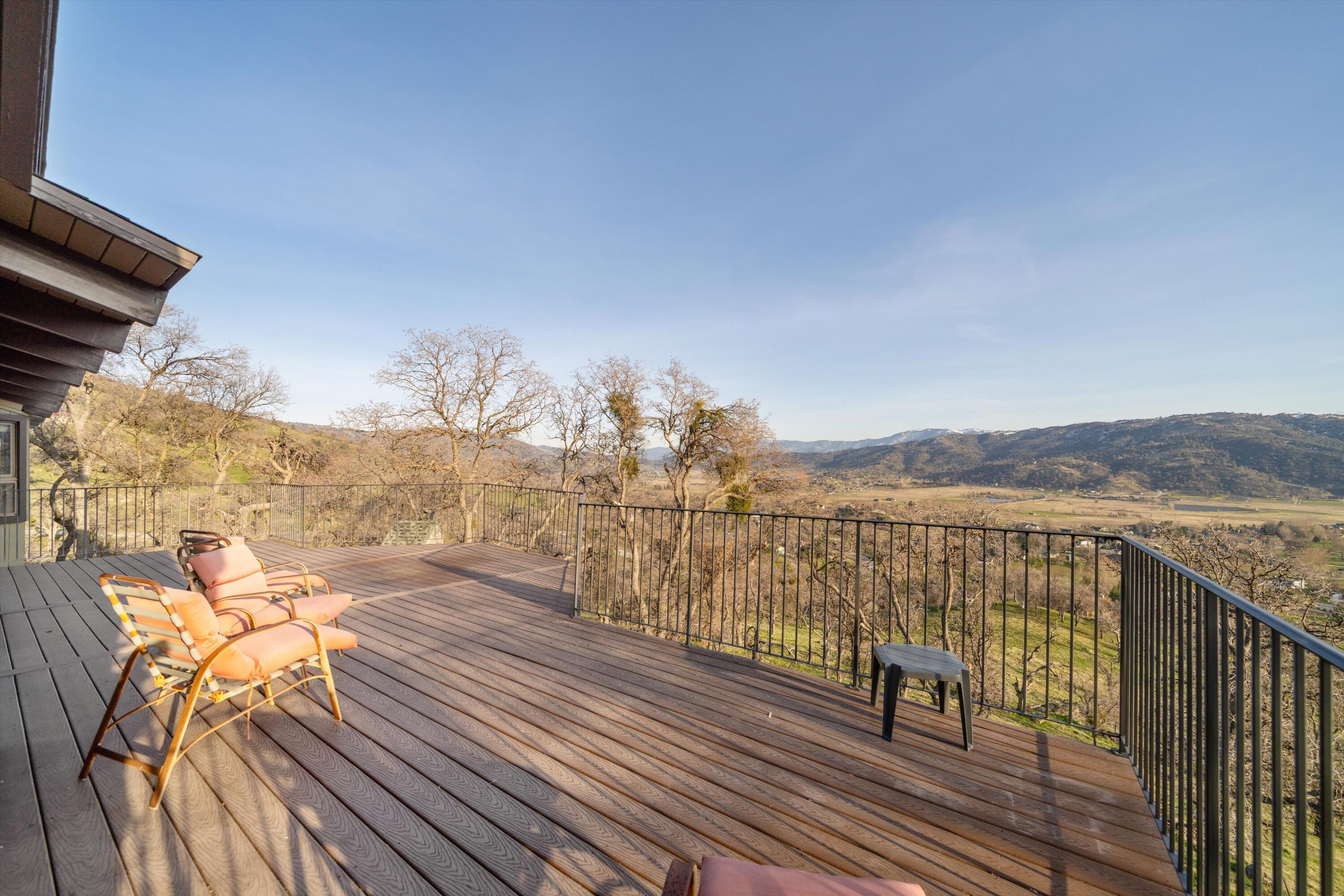 24701 Deertrail Drive Tehachapi, CA 93561 - Photo 16 of 24 a view of a balcony with chair and wooden floor