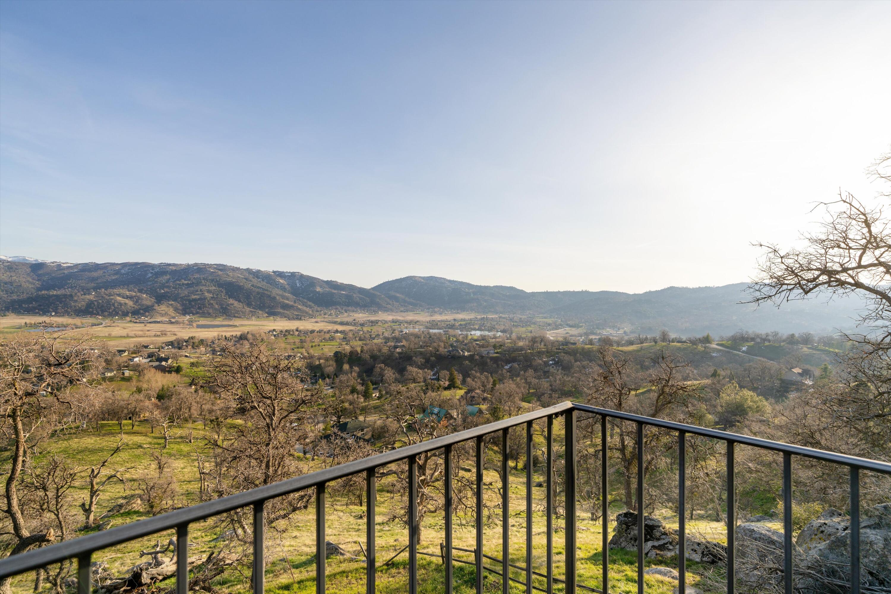 24701 Deertrail Drive Tehachapi, CA 93561 - Photo 18 of 24 a view of city and a mountain from a balcony