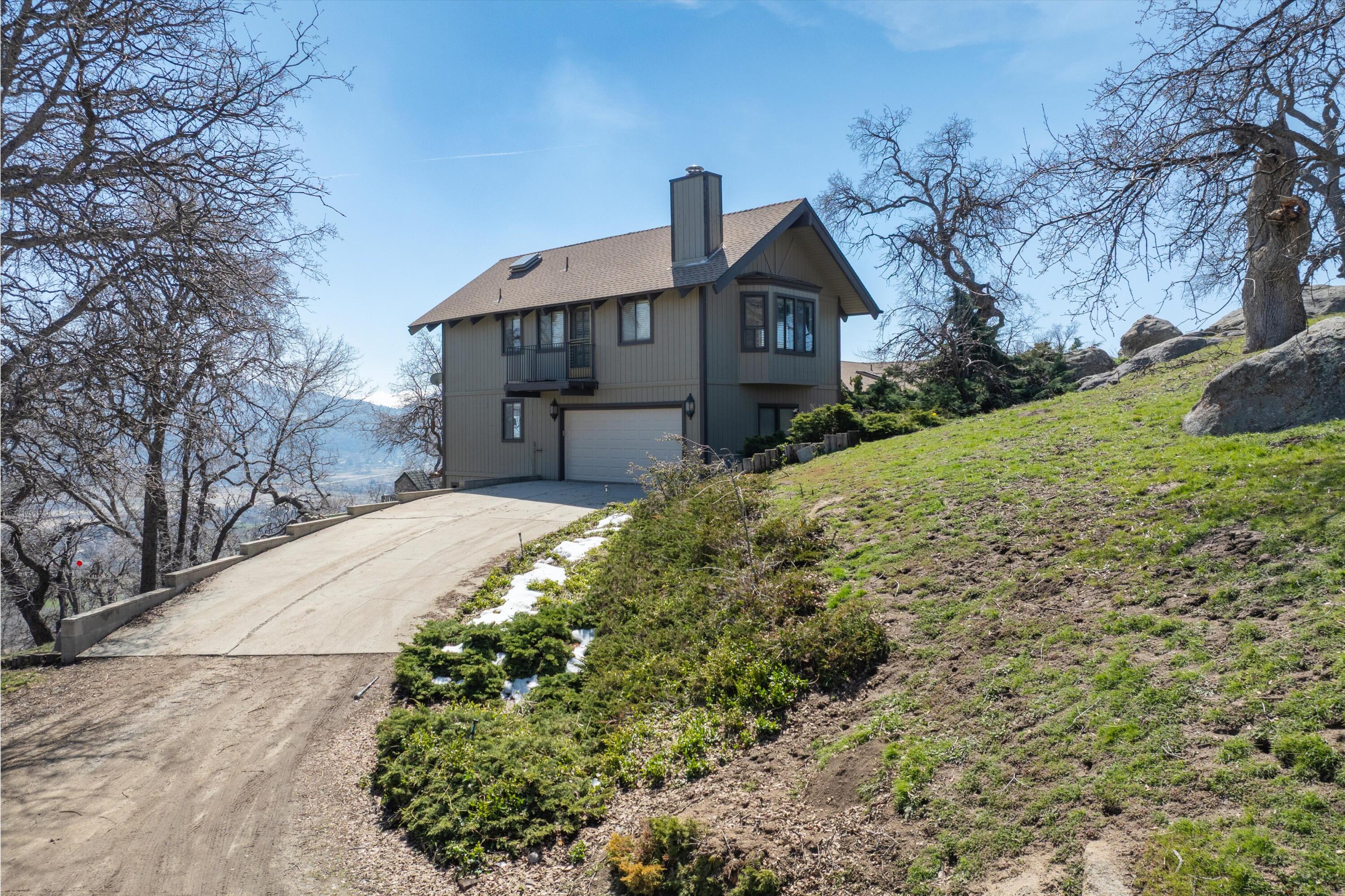 24701 Deertrail Drive Tehachapi, CA 93561 - Photo 20 of 24 a front view of a house with a yard
