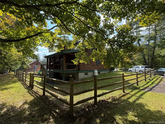 a view of outdoor space with wooden fence