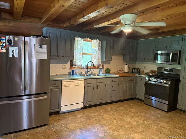 a dining room with furniture a rug and wooden floor