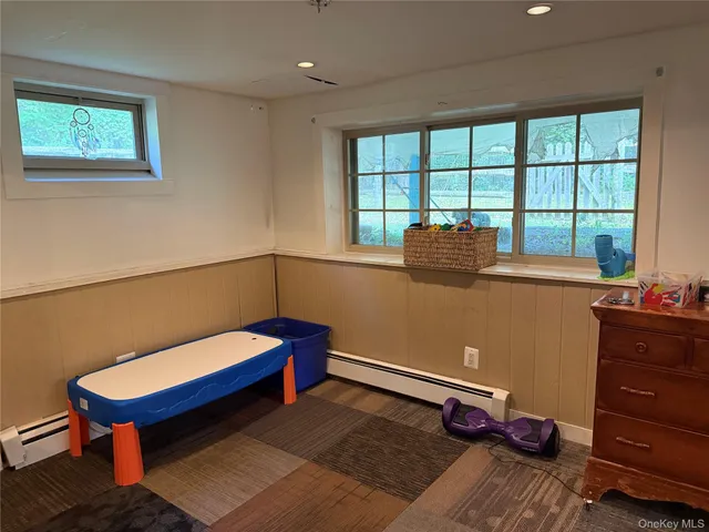 a bathroom with a toilet and a shower curtain