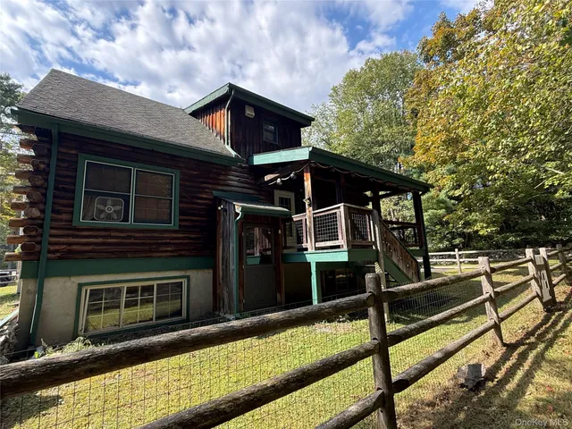 a front view of a house with wooden stairs
