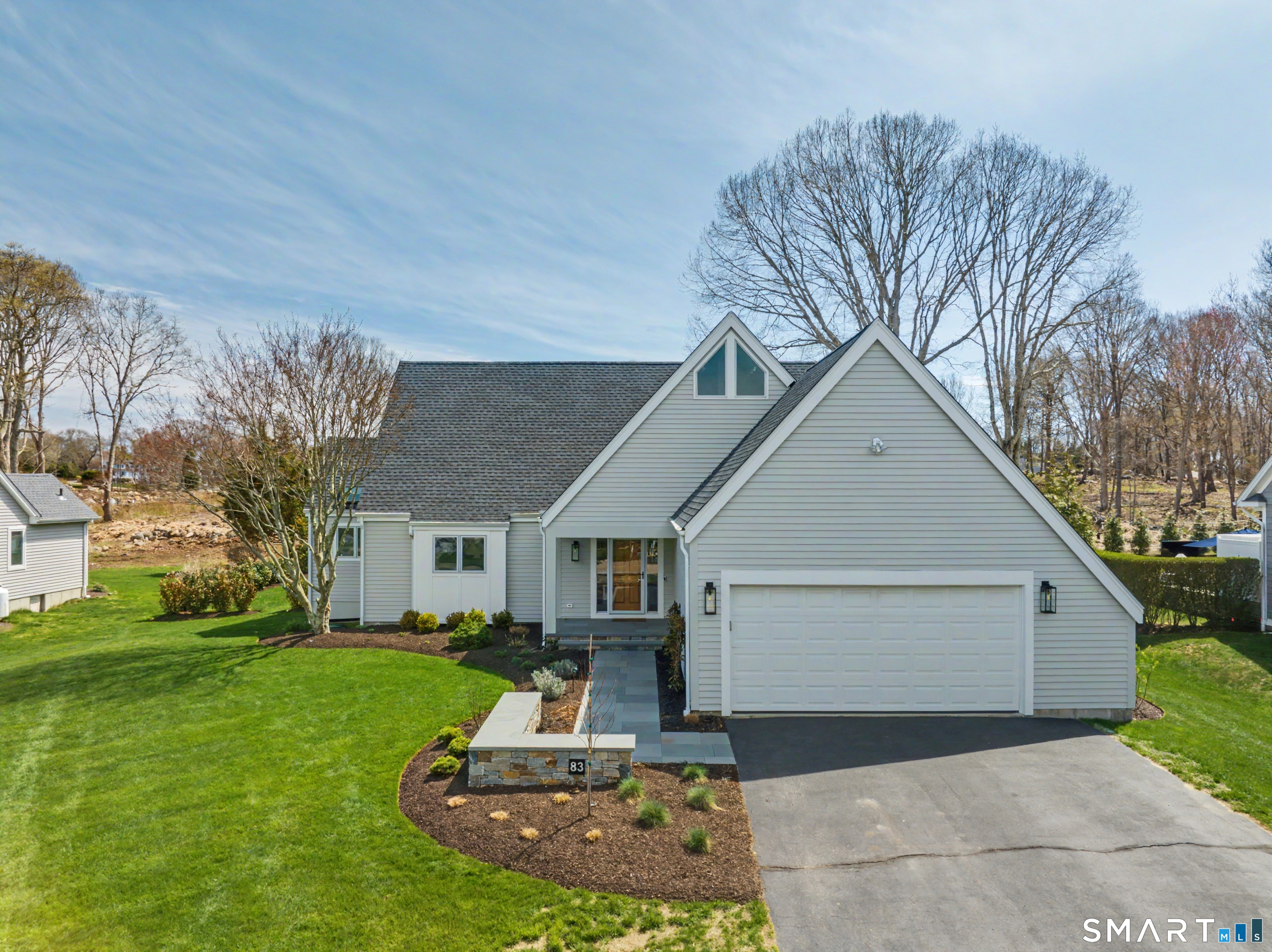 83 Old North Road Stonington, CT 06355 - Photo 1 of 40 a front view of a house with a yard