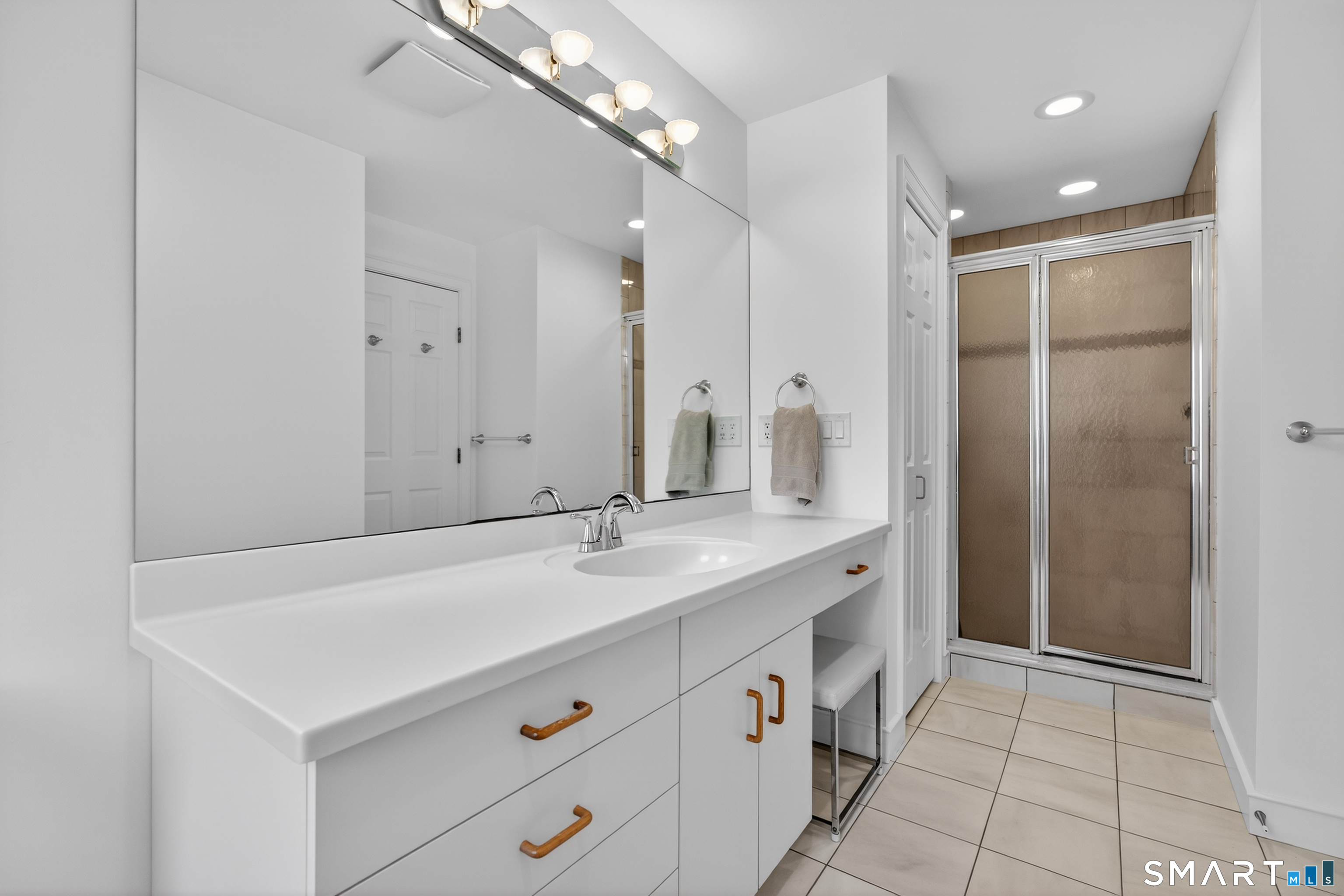 83 Old North Road Stonington, CT 06355 - Photo 17 of 40 a bathroom with a sink and a mirror