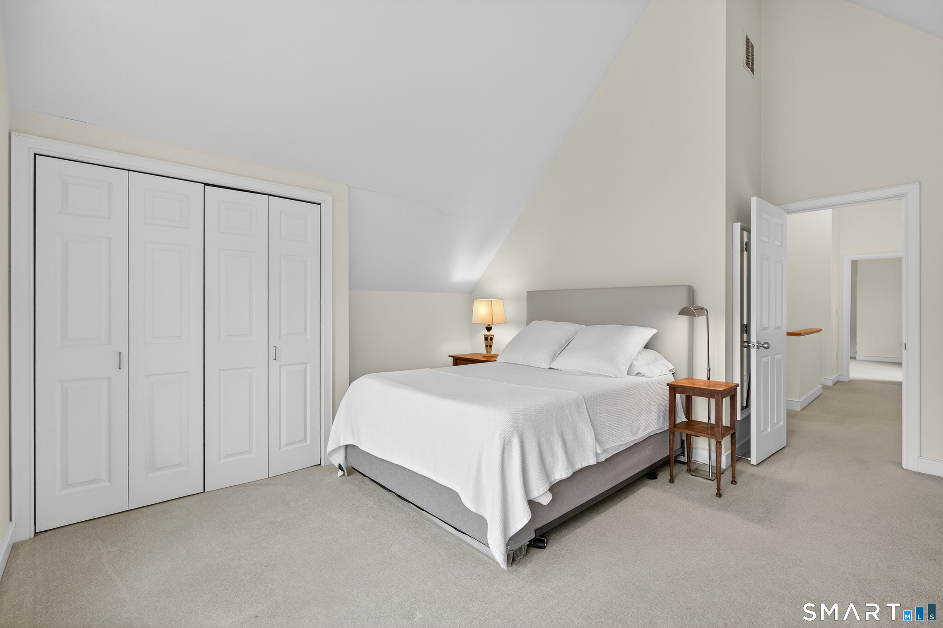 83 Old North Road Stonington, CT 06355 - Photo 24 of 40 a bedroom with a bed and a closet