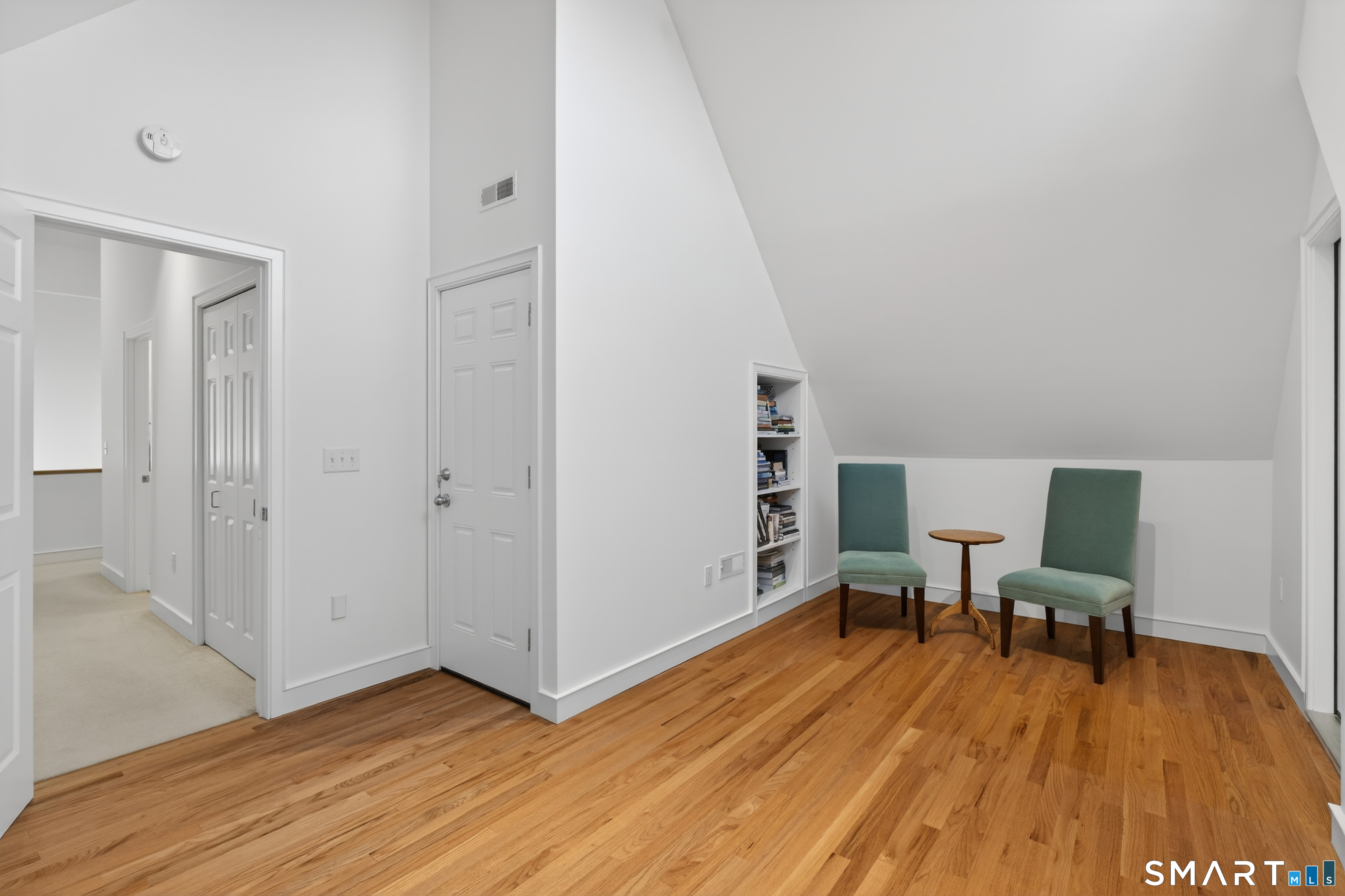 83 Old North Road Stonington, CT 06355 - Photo 29 of 40 a workspace with wooden floor and furniture