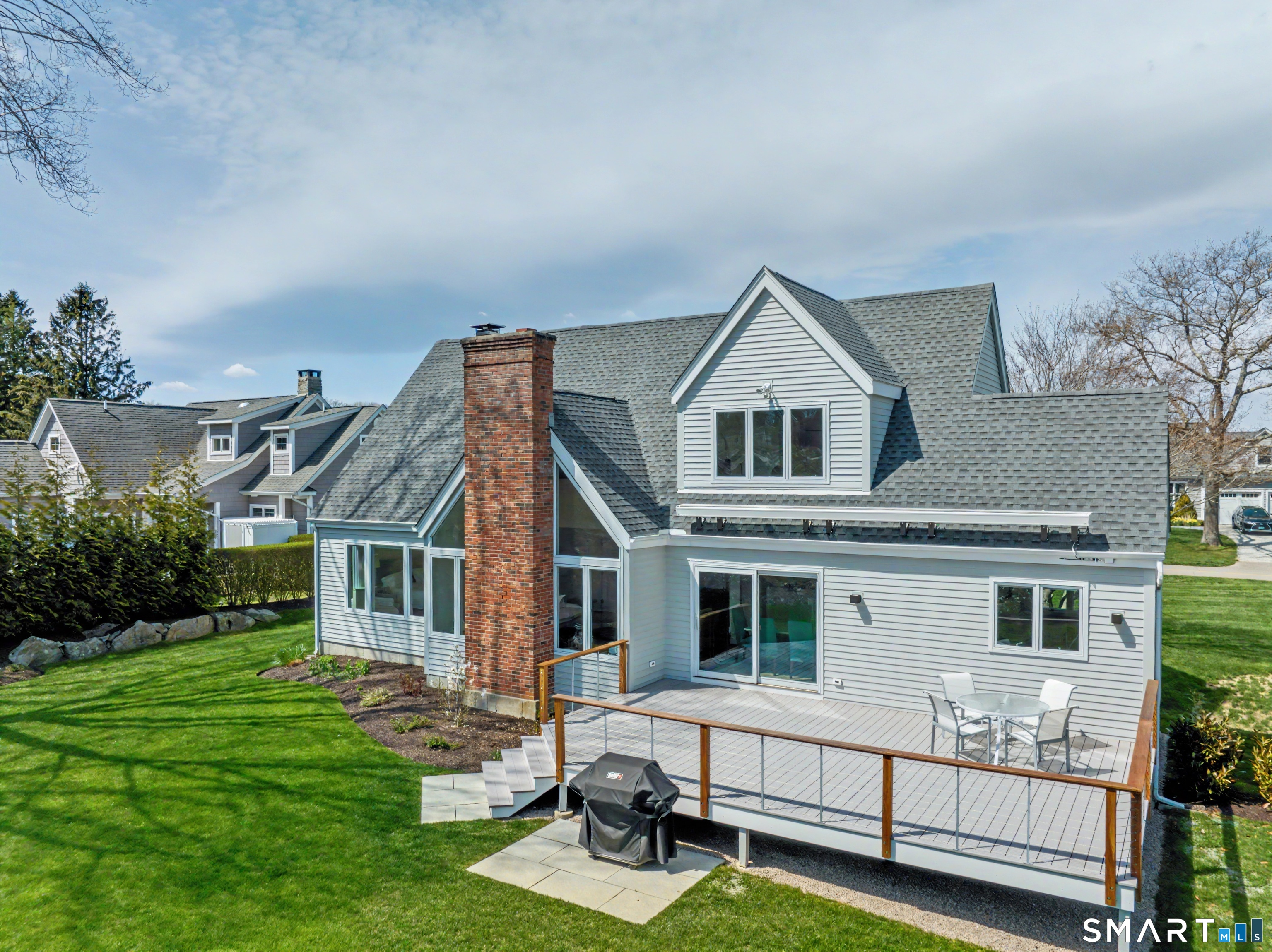 83 Old North Road Stonington, CT 06355 - Photo 34 of 40 a view of house with a yard and sitting area