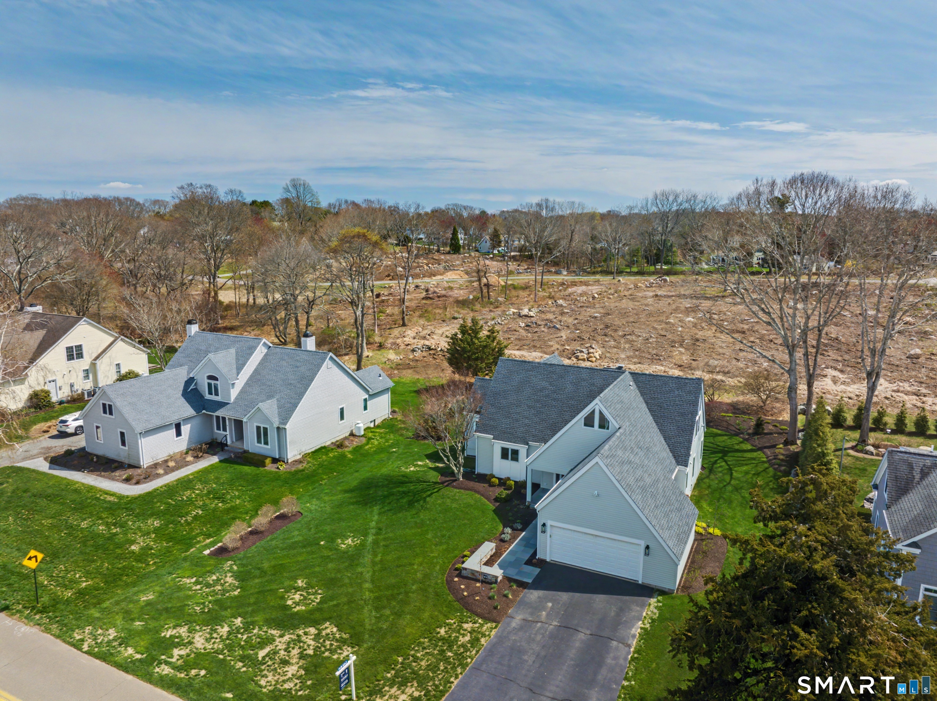 83 Old North Road Stonington, CT 06355 - Photo 36 of 40 an aerial view of a house with a garden and lake view