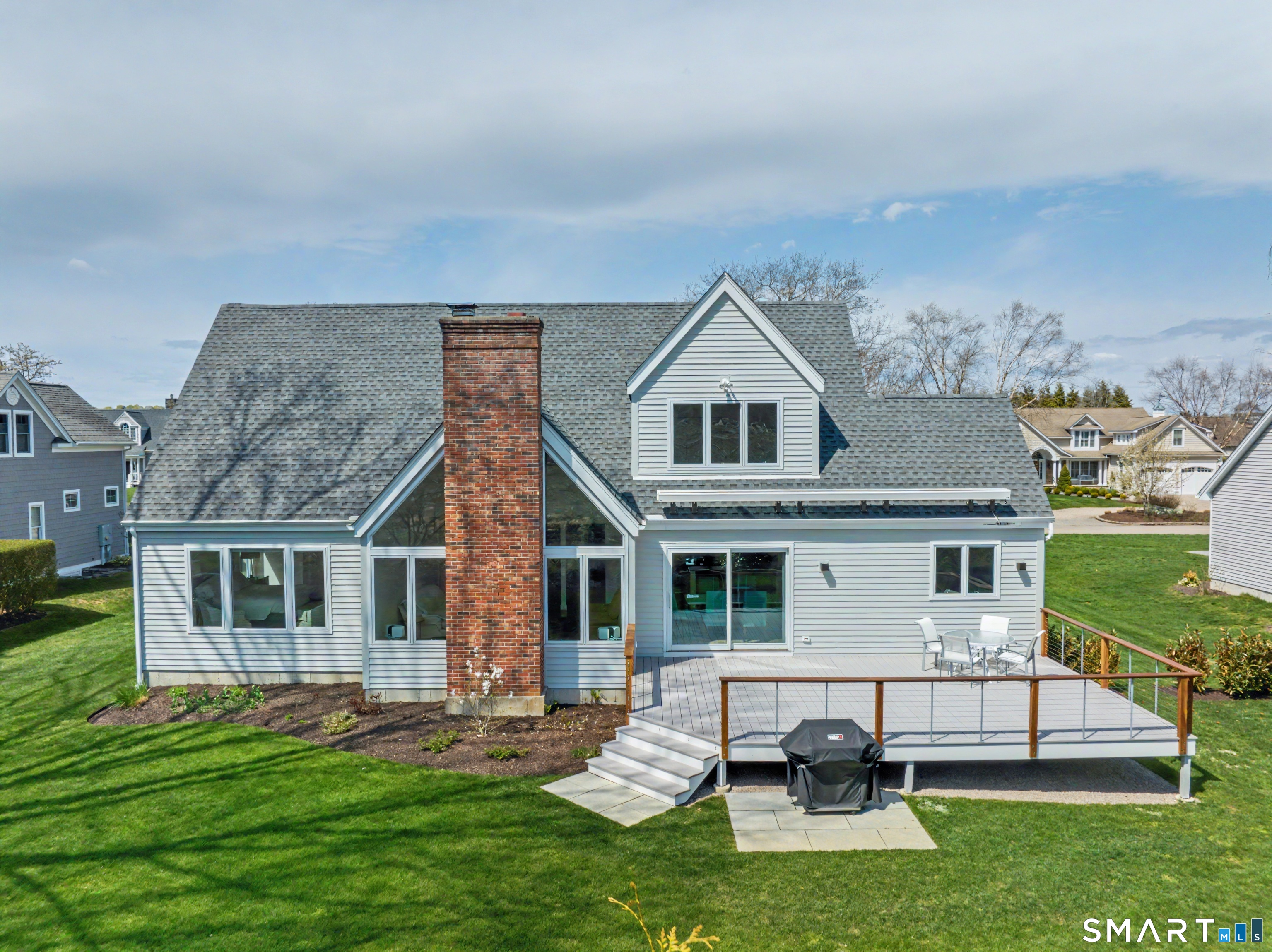 83 Old North Road Stonington, CT 06355 - Photo 9 of 40 a view of a house with a yard porch and sitting area
