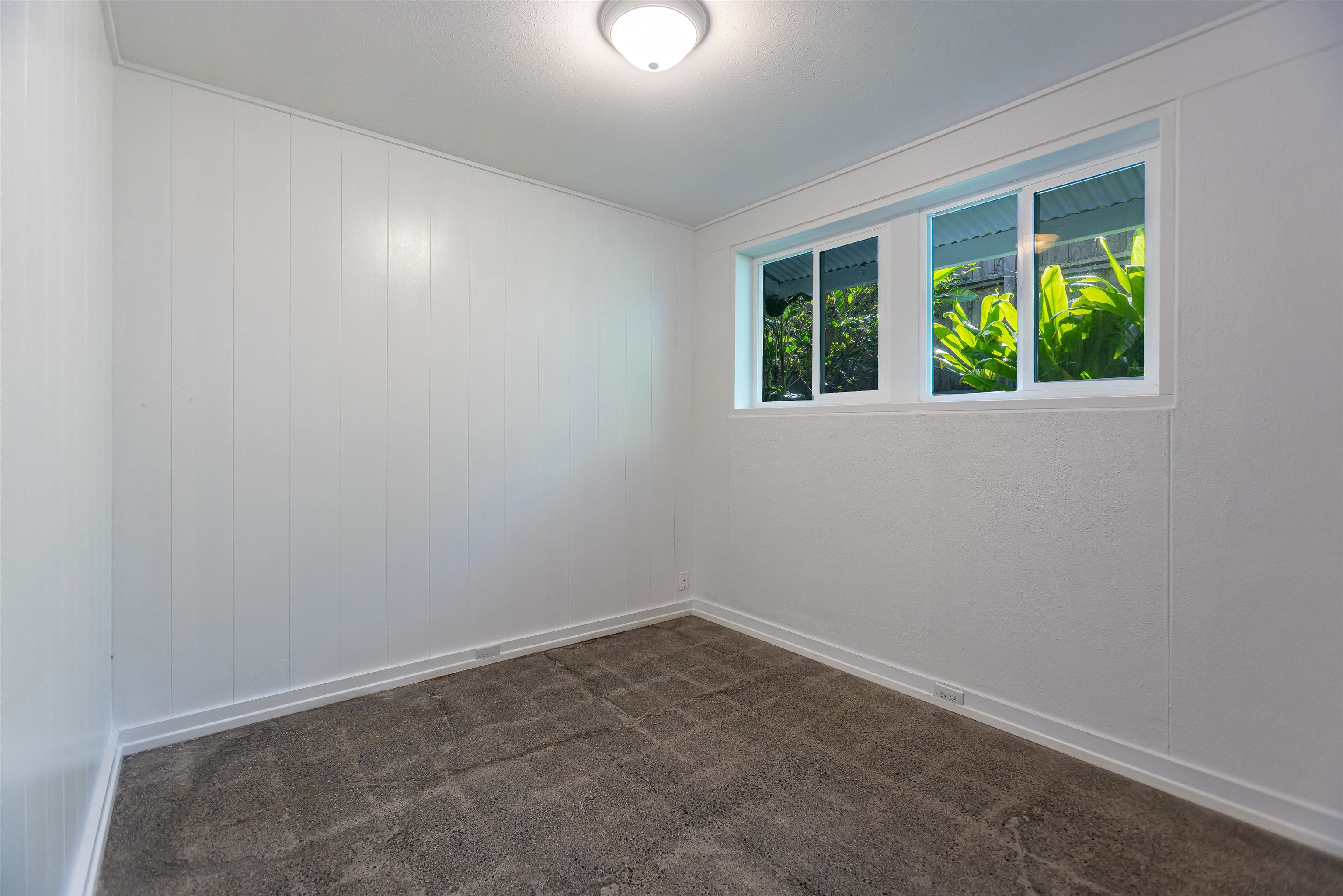 720 Mopua Street Haiku, HI 96708 - Photo 11 of 20 an empty room with windows